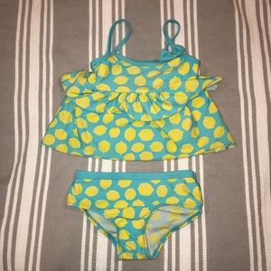 Girl’s lemon swim suit.